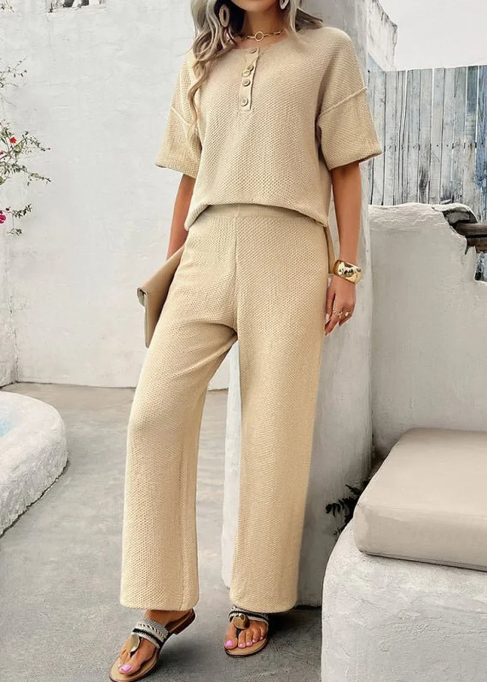 Knit short sleeve top and trousers set in black.