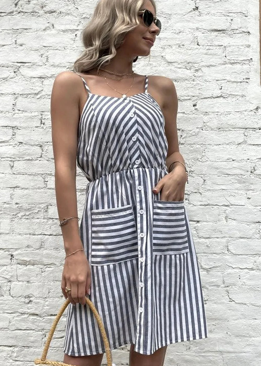 Model wearing grey striped slip dress