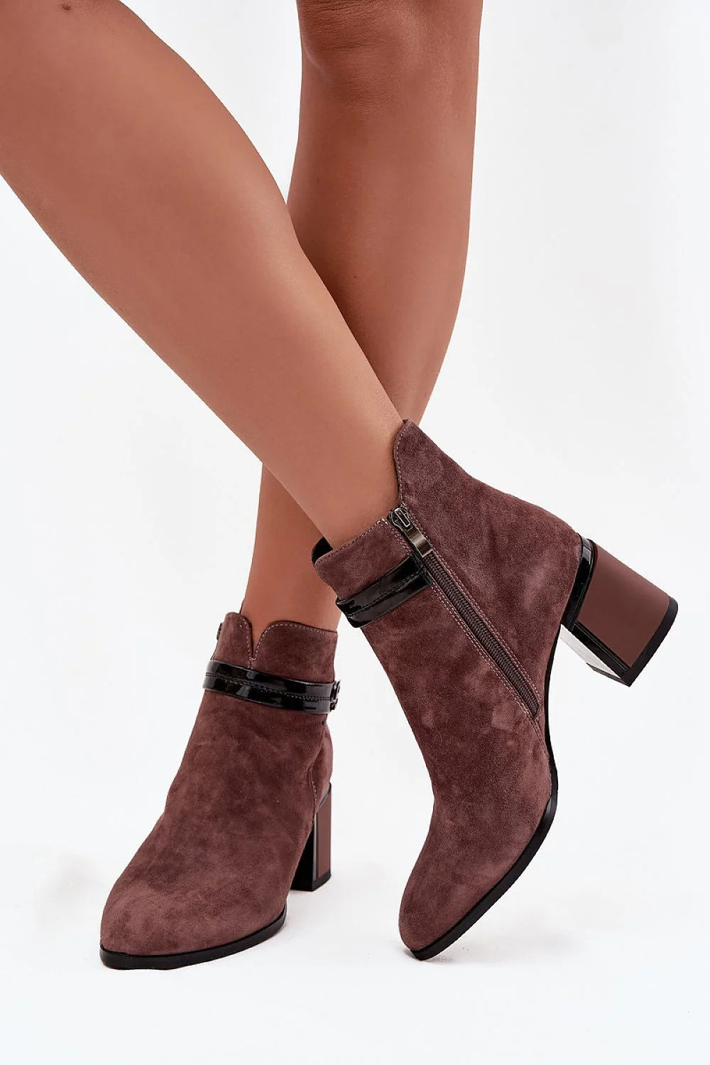 Women wearing brown suede ankle boots