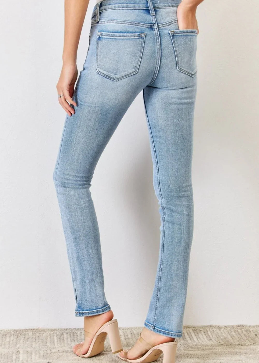 Raw hem detail on navy jeans