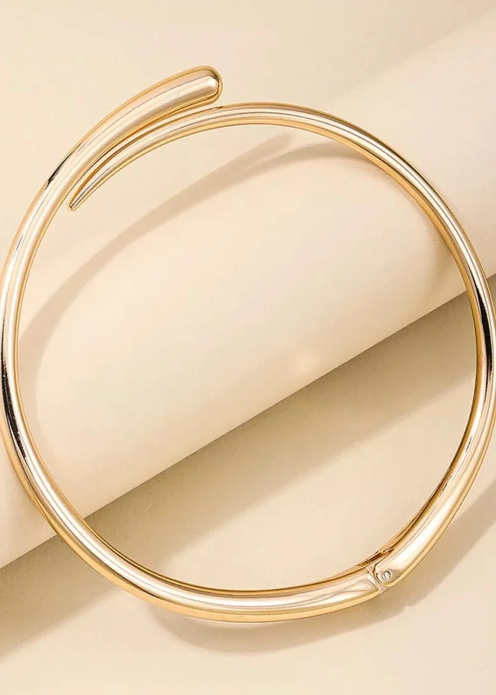 Model wearing a gold necklace