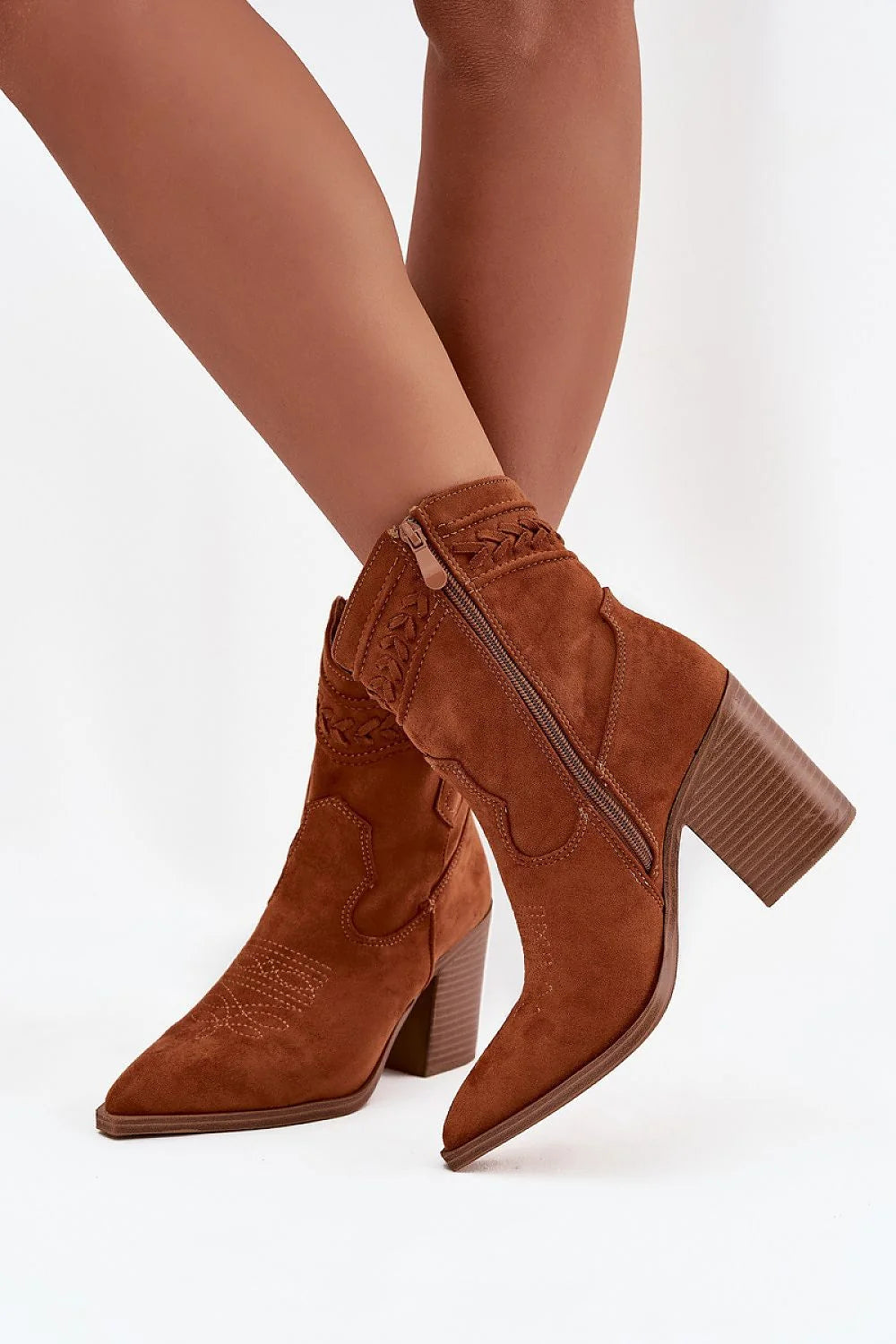Side view of brown cowgirl-inspired ankle boots