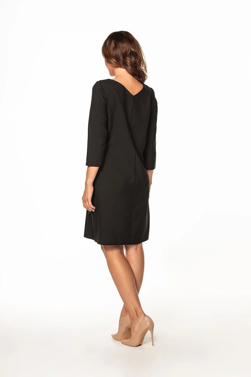 Black V-neck dress with 3/4 sleeves, regular fit, on model with nude heels.
