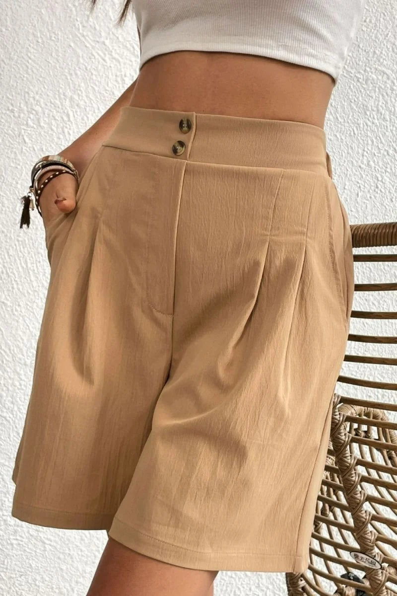 Camel high-waisted shorts with subtle texture and two button details.