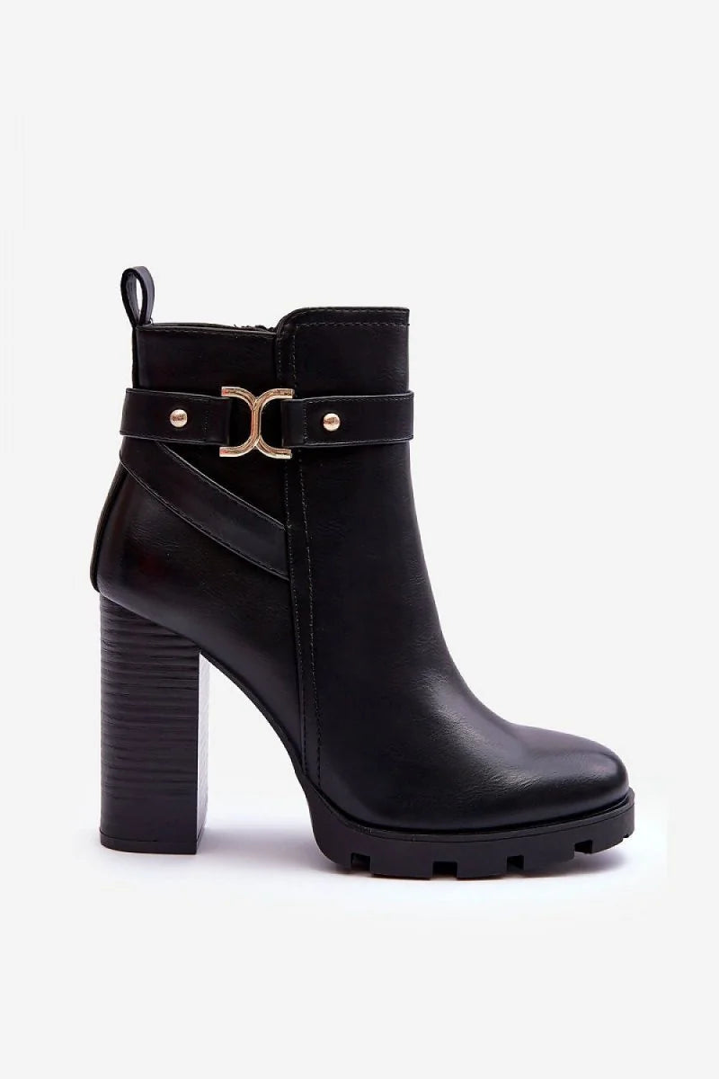 Black eco-leather ankle boots with a chunky heel, lug sole, and gold buckle detail.