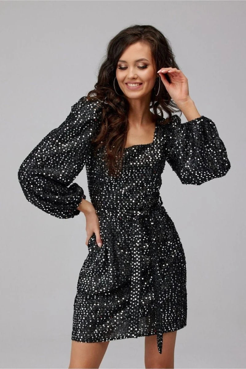 Sparkly black sequin dress with puff sleeves and a square neckline on a model.