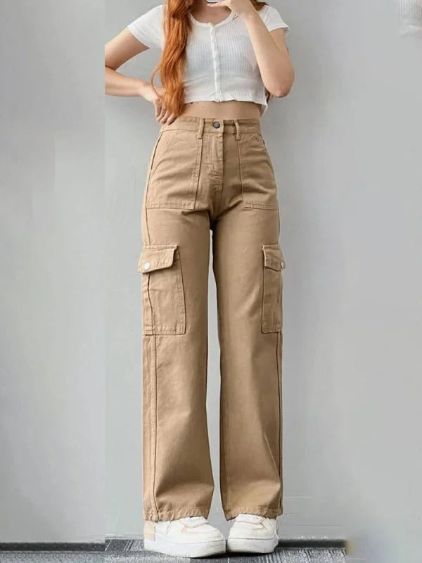 Khaki relaxed-fit cargo pants with large side pockets and a button closure, shown on a model.