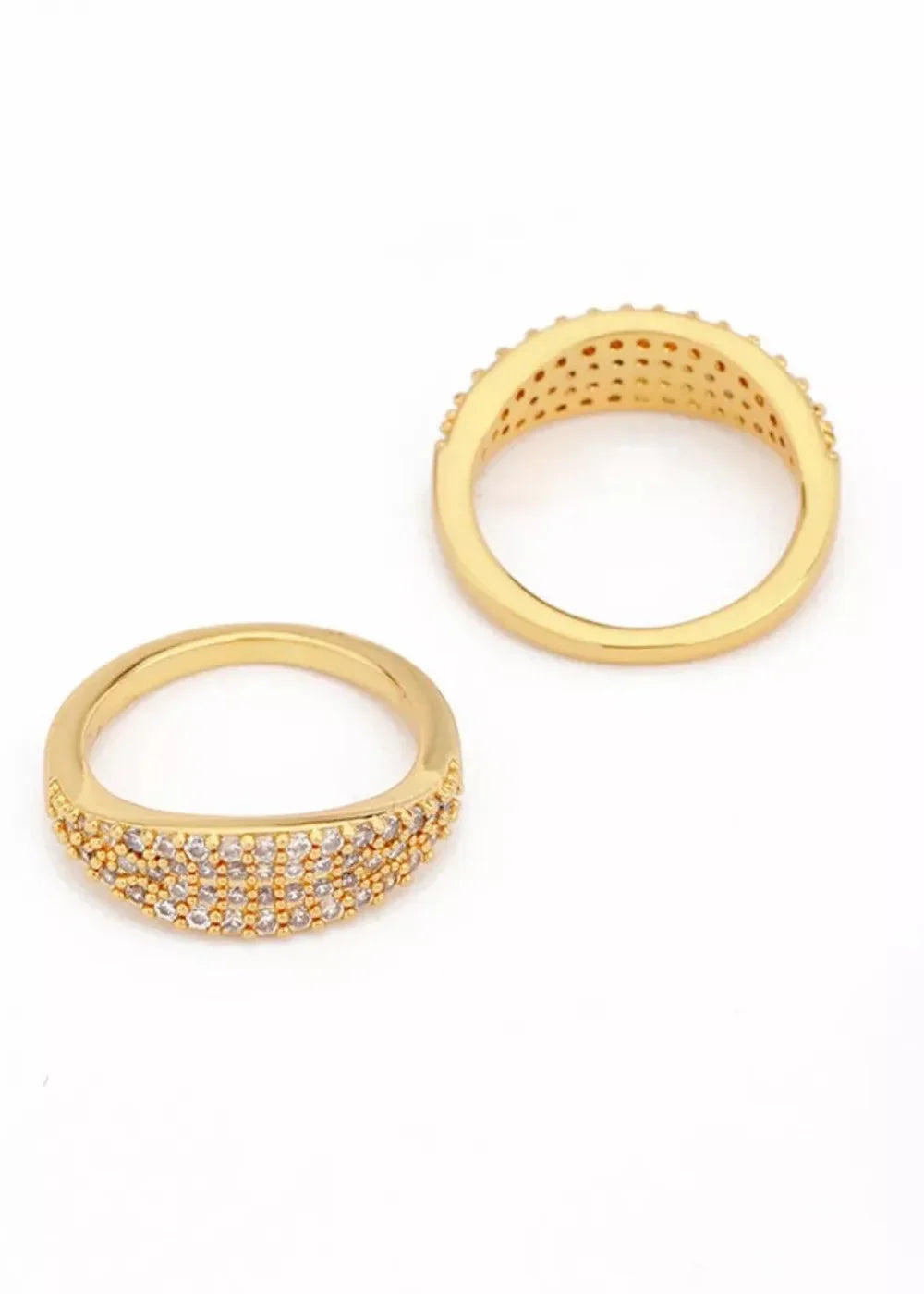 Two gold-plated rings with rows of sparkling cubic zirconia stones against a white background.