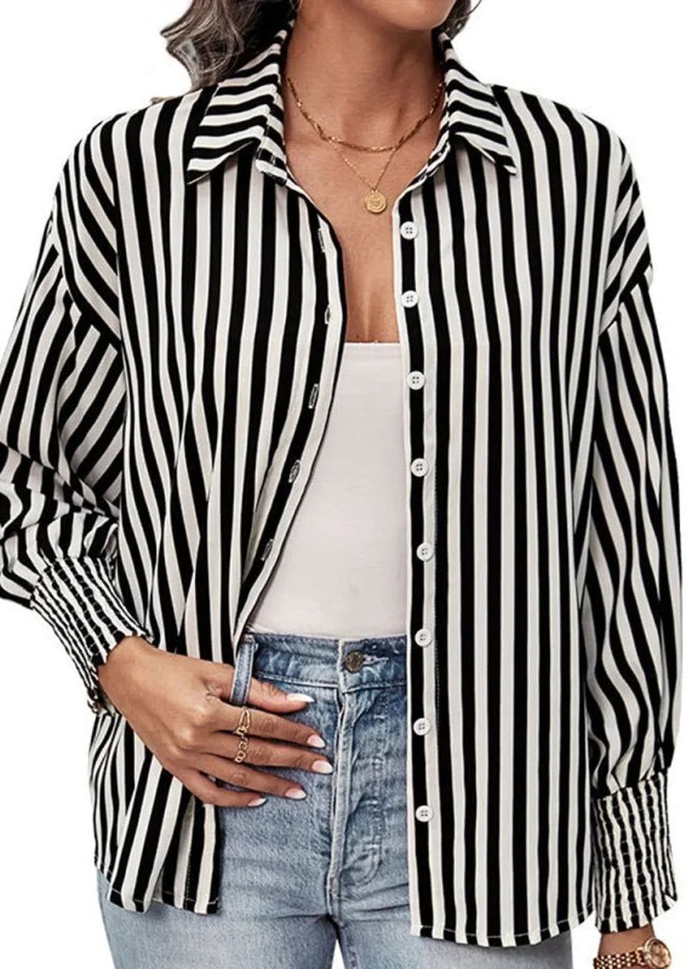 Model wearing a black and white striped long sleeve top