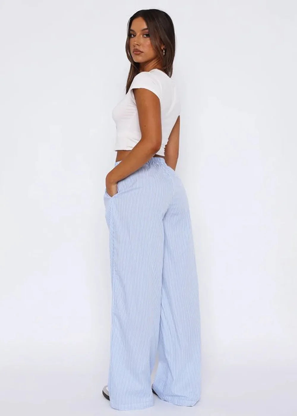 Light blue and white striped wide-leg pants with pockets, shown on a model.