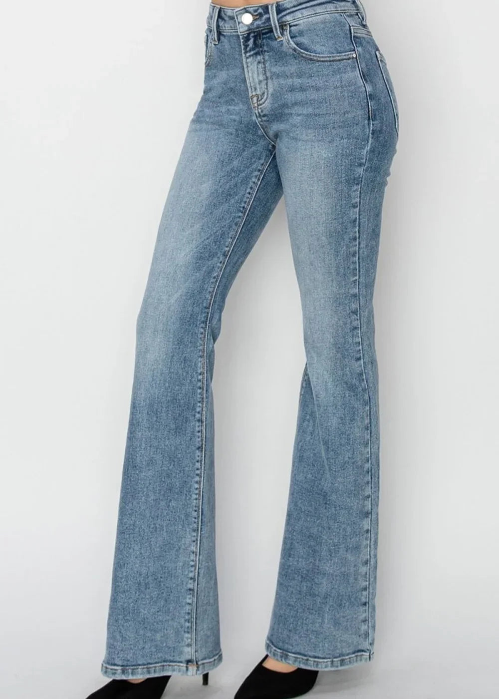 Light blue wash flare jeans with a textured denim look, shown on a model.