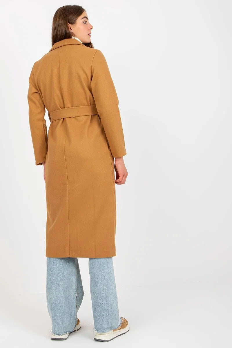 Back view of a woman wearing a brown belted trench coat and light blue wide-leg jeans.