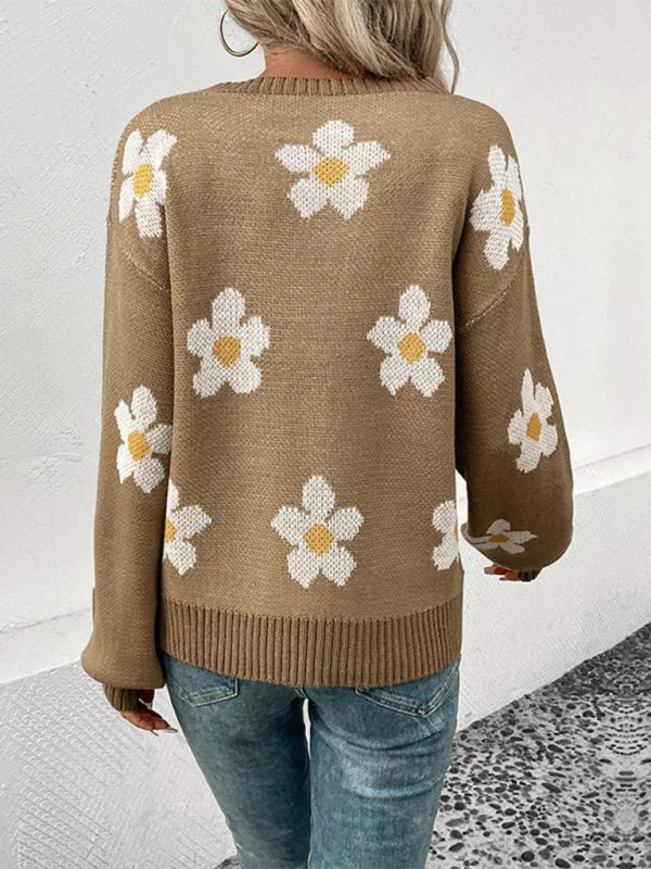 Brown acrylic knit sweater with a white and yellow floral pattern, long sleeves, and ribbed hem.