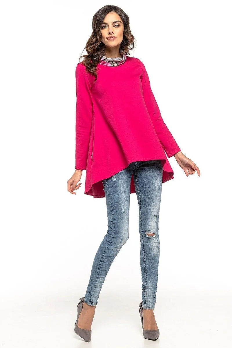 Model wearing a green tunic with side seam pockets