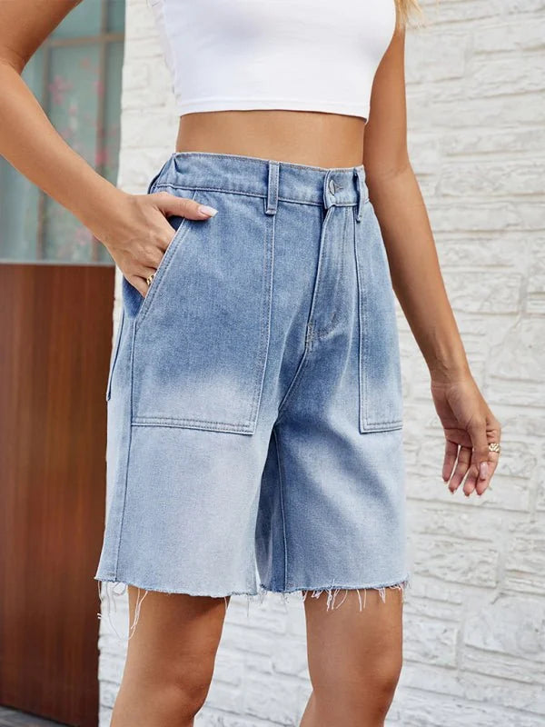 Model wearing blue gradient denim shorts