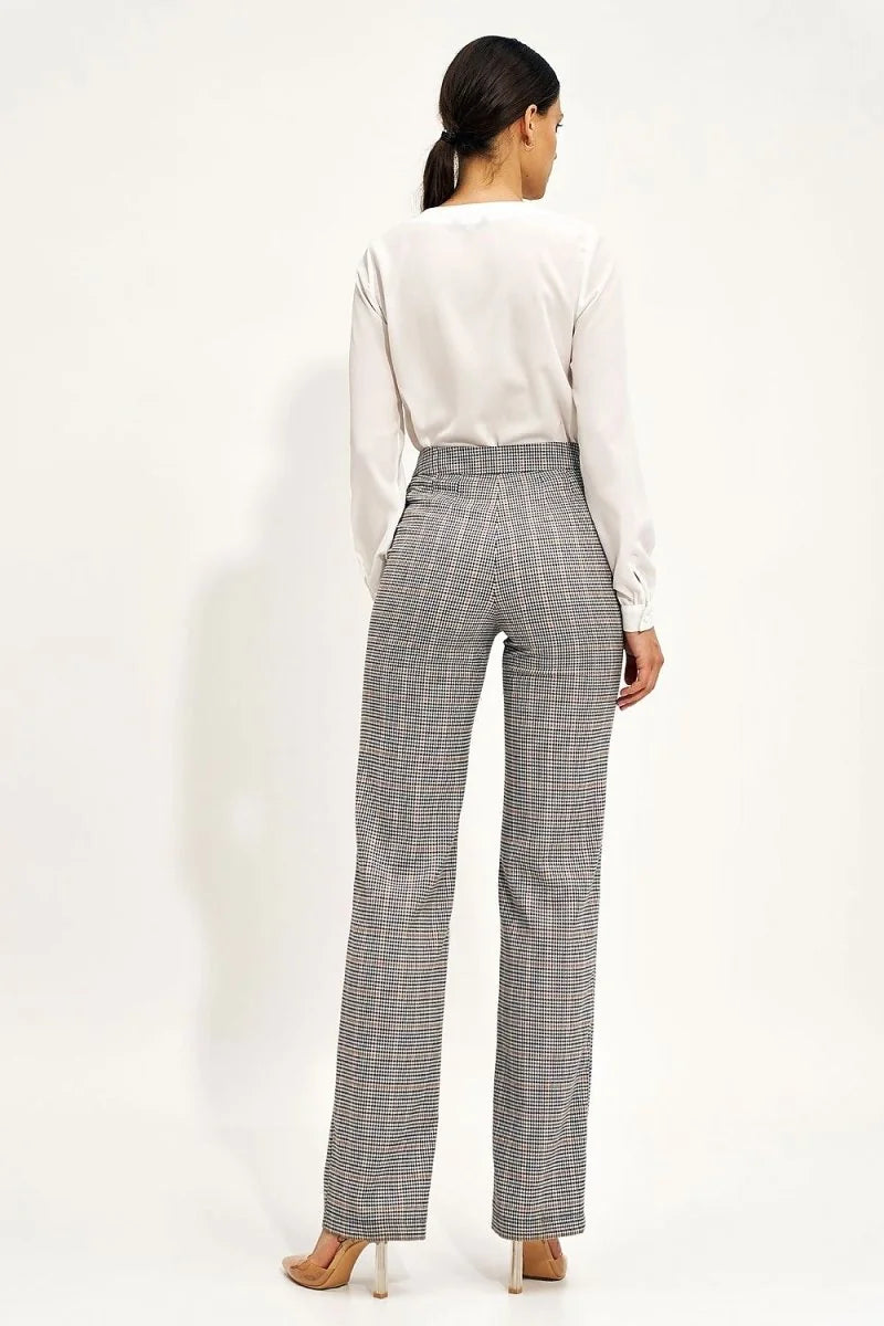 Back view of high-rise checkered pants with a plaid pattern in grey, black, and brown.