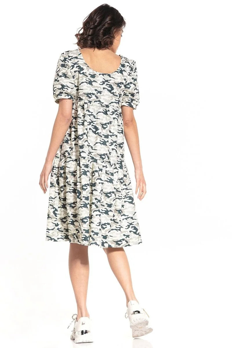 Back view of a relaxed-fit cotton dress with a camouflage pattern in shades of grey, green, and cream.