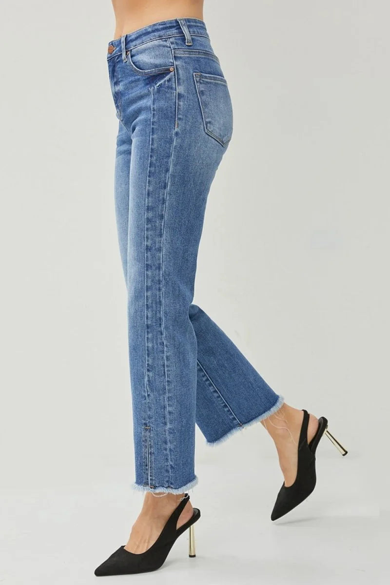 High-waisted, light wash denim jeans with a frayed hem and subtle vertical seam detail.