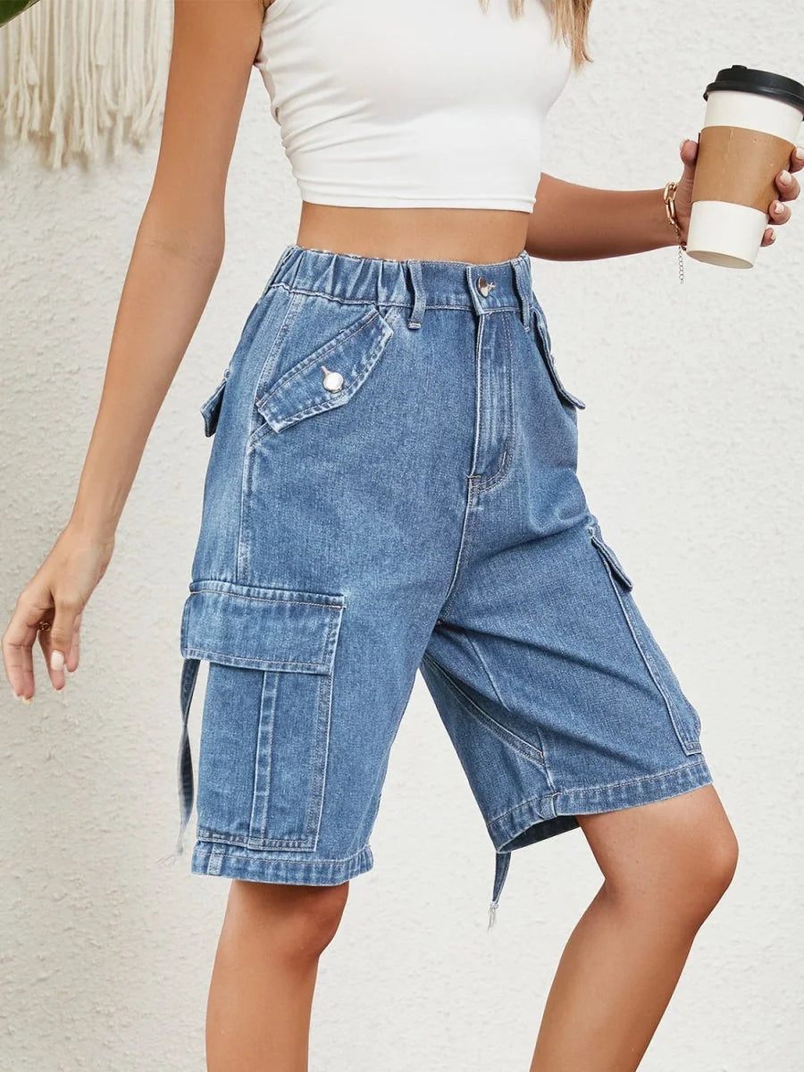 Model wearing high waist denim shorts