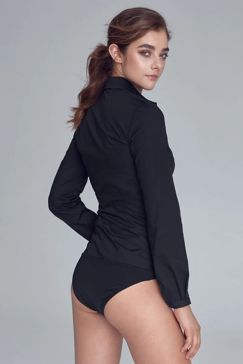 Black long-sleeve button-up shirt and black high-waisted bottoms on a model.