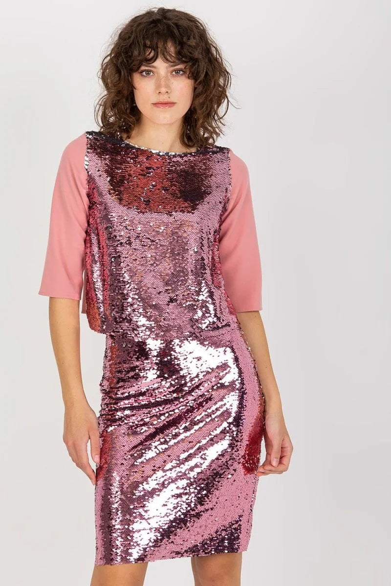Woman wearing a pink sequin blouse