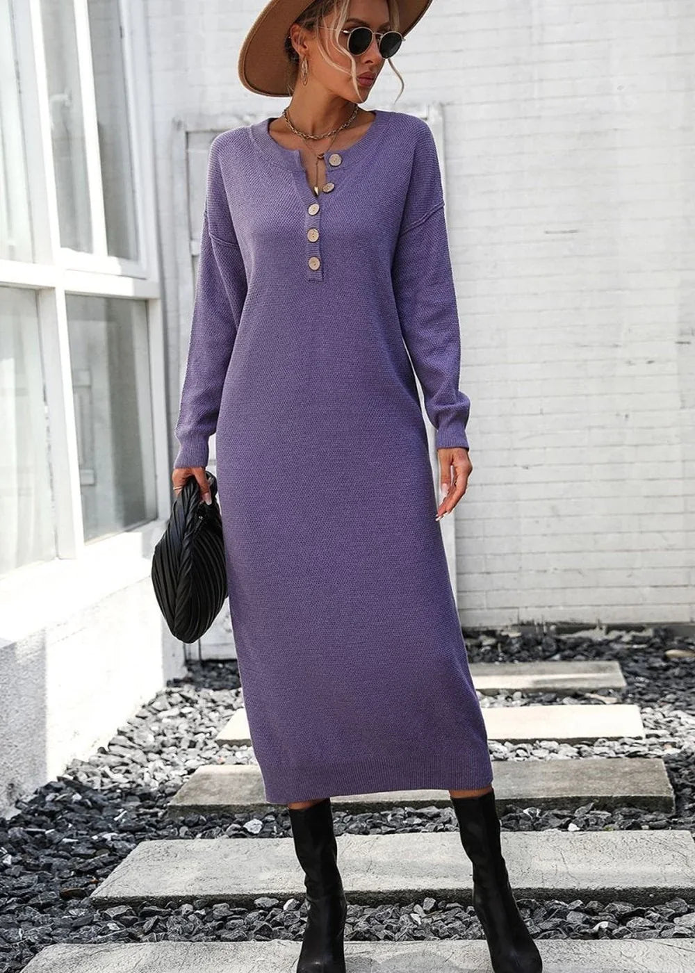 Purple knit sweater dress with button detail, long sleeves, and black boots on model.