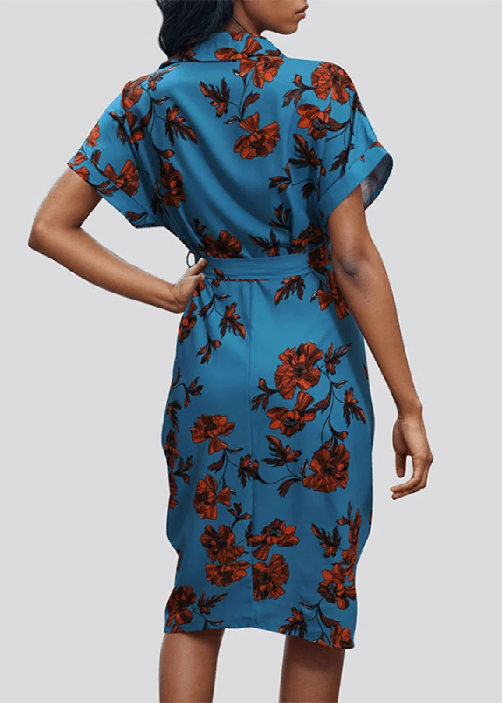 Blue polyester dress with a vibrant red floral print, featuring short sleeves and a cinched waist.