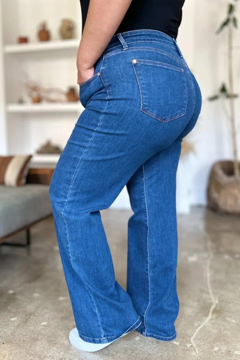 Medium wash, flared denim jeans with a regular fit and visible stitching detail.
