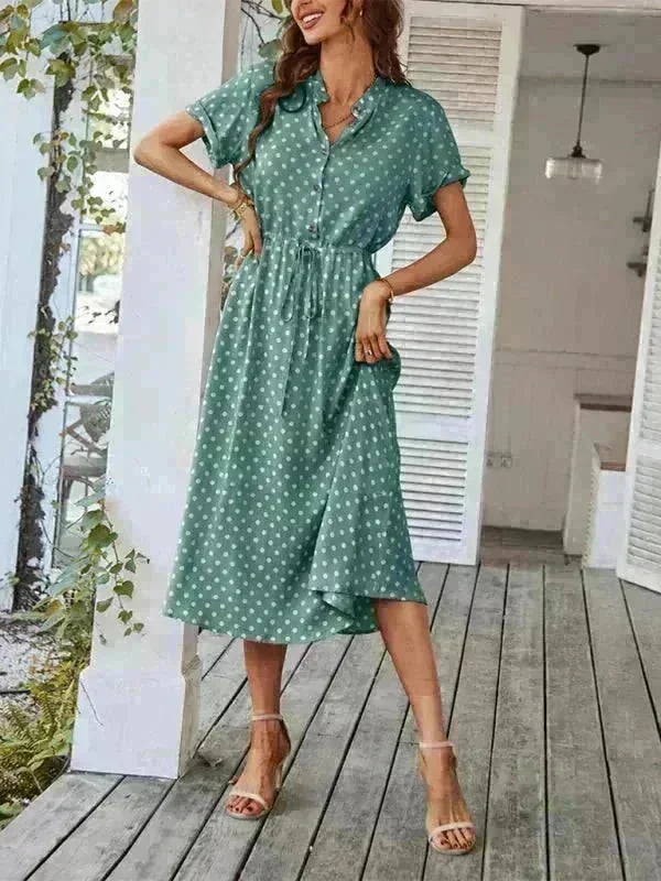 Model wearing a polka dot waist dress