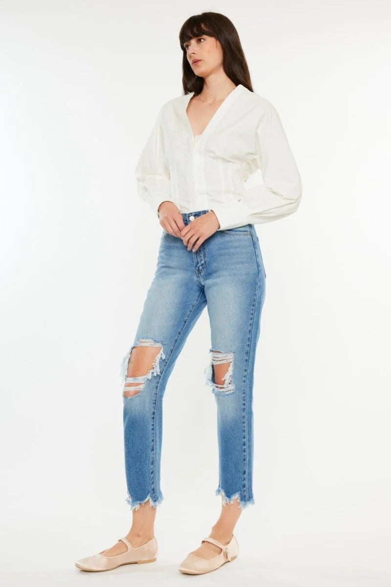 Model wearing distressed cropped jeans