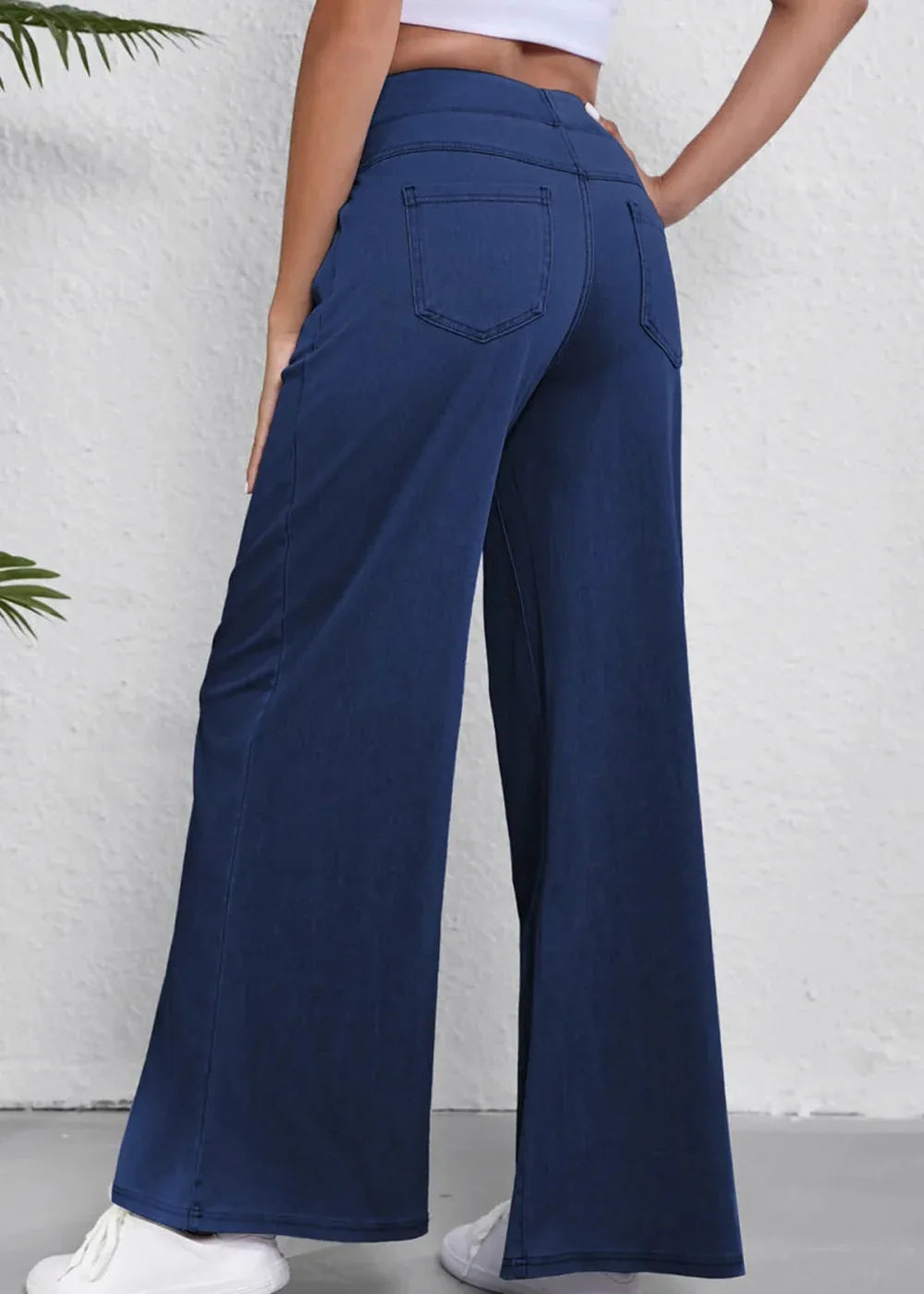 Navy blue wide-leg pants with a regular fit, showing the back pockets and hem.
