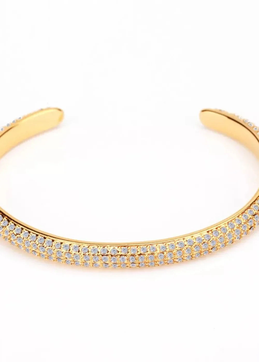 Gold-plated cuff bracelet with two rows of sparkling white cubic zirconia stones.