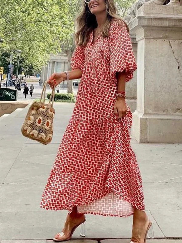 Model wearing geometric collage puff sleeve dress