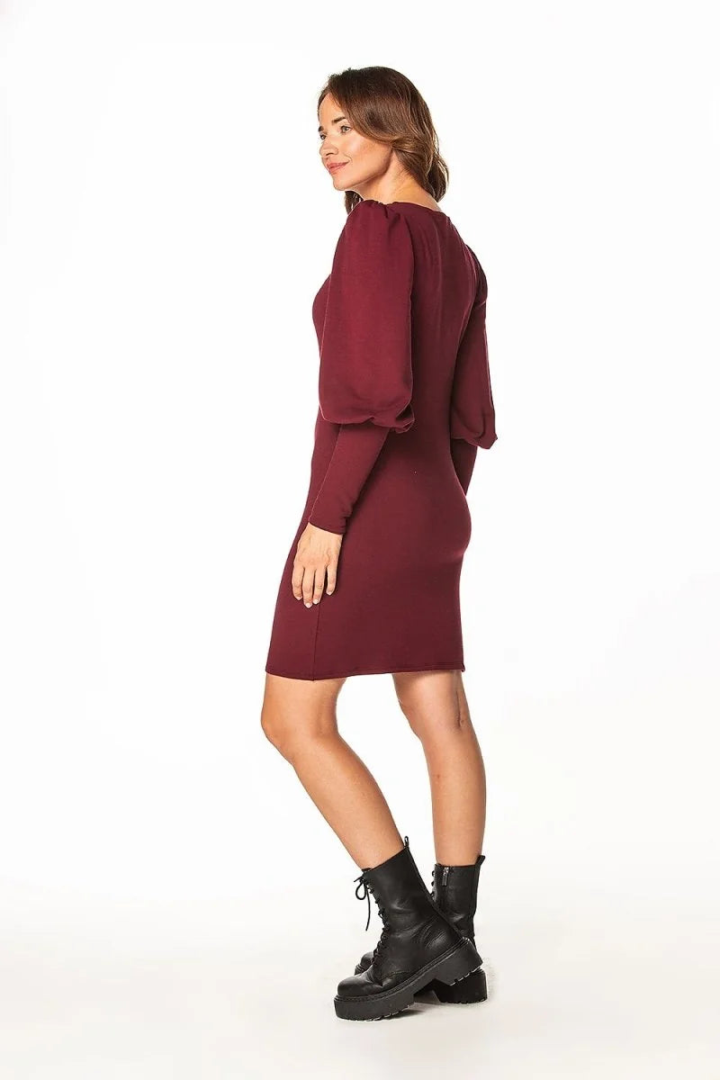 Maroon long-sleeve dress with puff sleeves and black combat boots on a model.