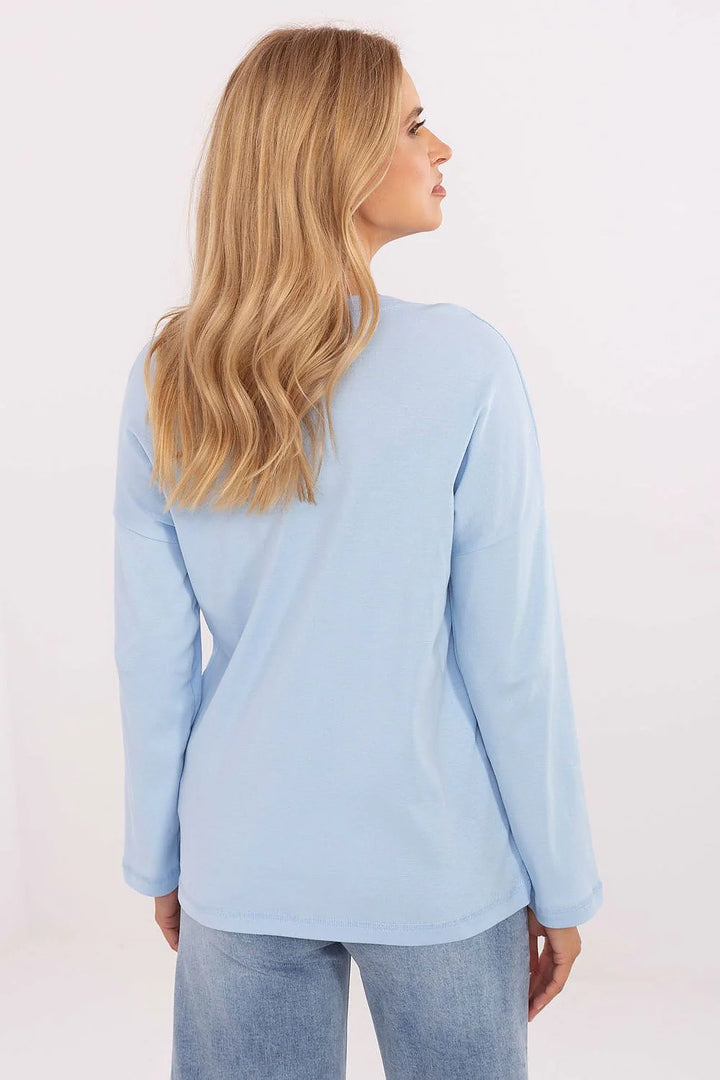 Light blue long-sleeve cotton-spandex top with relaxed fit, shown from the back.