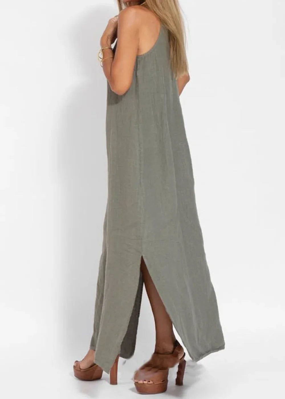 Olive green maxi dress with thigh-high slits and platform heels on model.