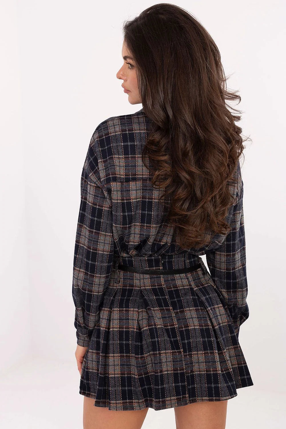 Back view of a navy, gray, and rust plaid mini dress with a belted waist and pleated skirt.
