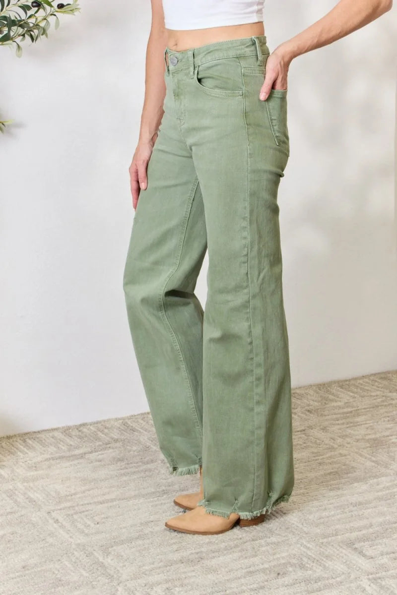 High-waisted olive green wide-leg jeans with frayed hem on model.