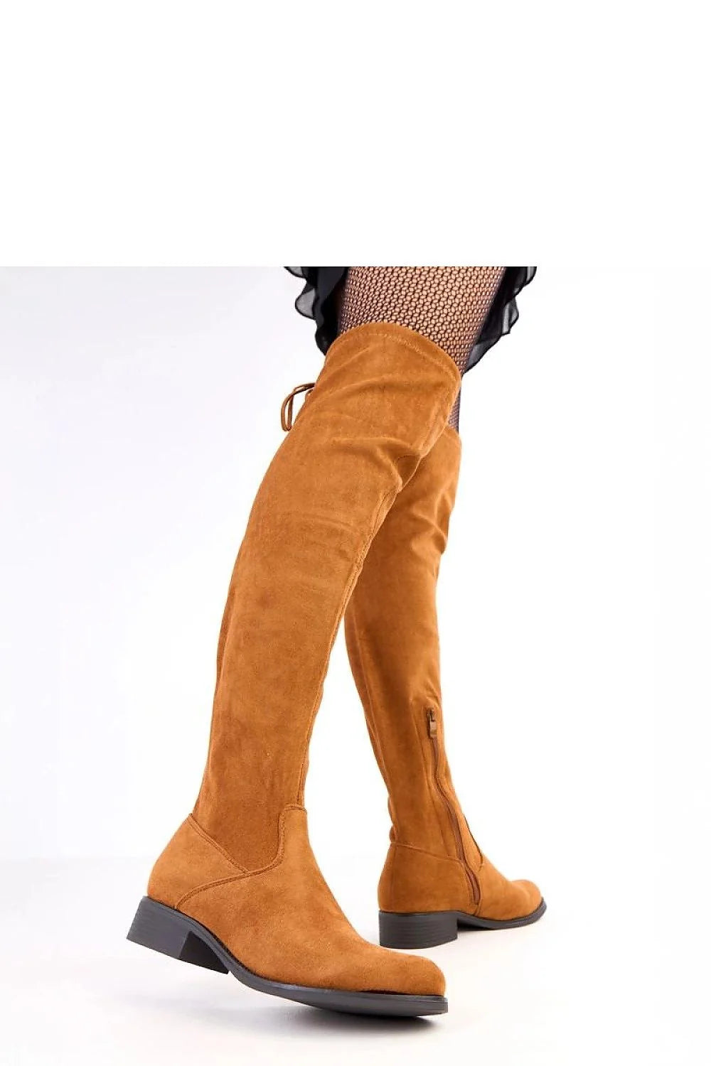 Brown faux suede thigh-high boots with a side zipper and tie detail, worn on a model.