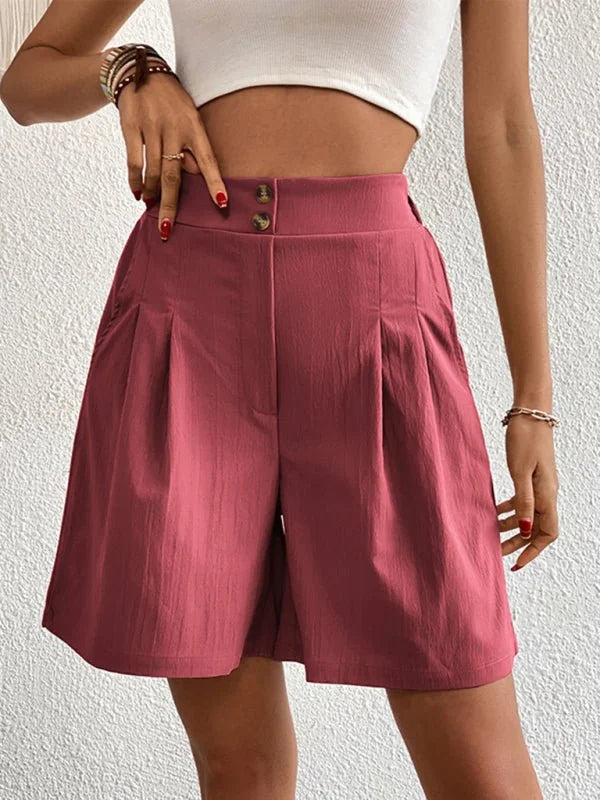 Rose pink polyester shorts with pleats and button details, regular fit.