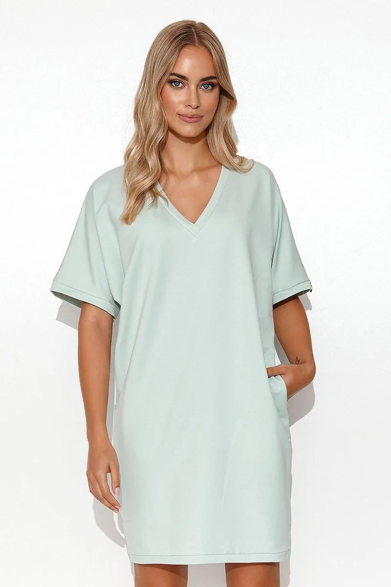 Light mint green V-neck dress with short sleeves and pockets, on a white background.