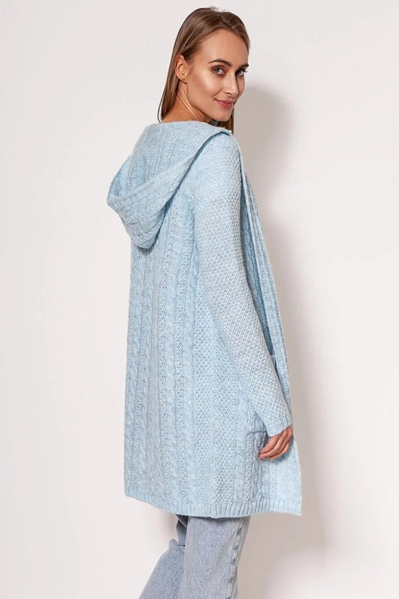 Light blue cable knit hooded cardigan with pockets, shown on a model.