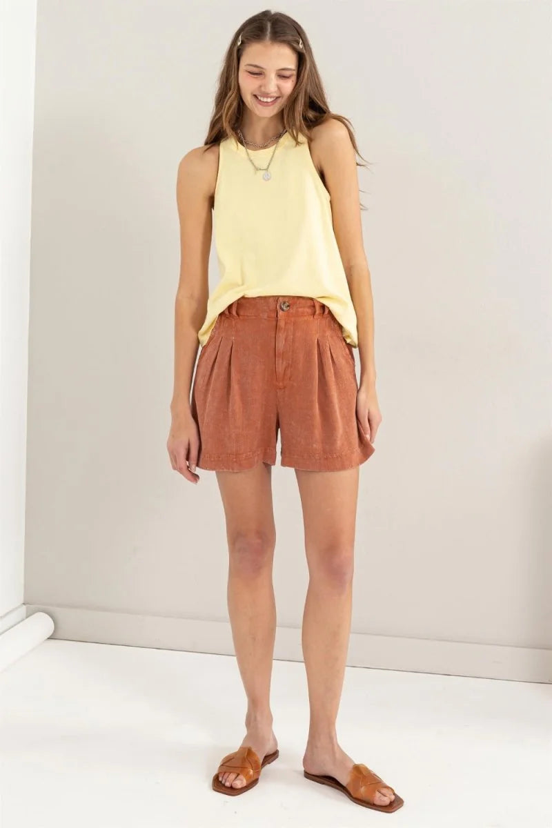 close-up of high-waist with pleats, showing rayon blend texture.