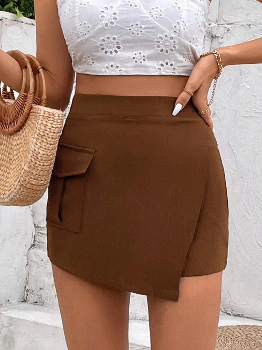 Brown asymmetrical skort with flap pocket and textured fabric detail on model.