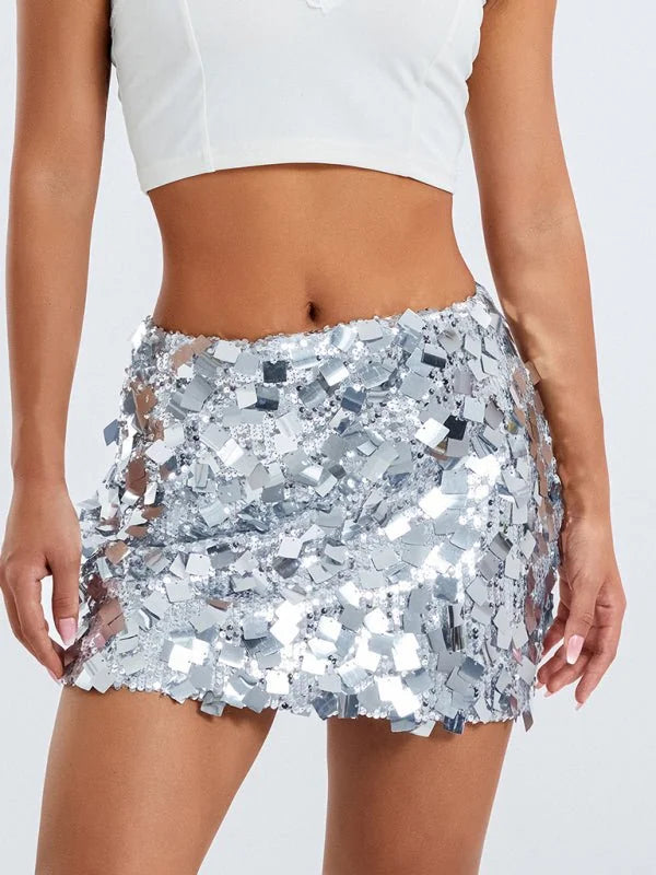 Silver sequin mini skirt with a textured, reflective surface, shown on model.