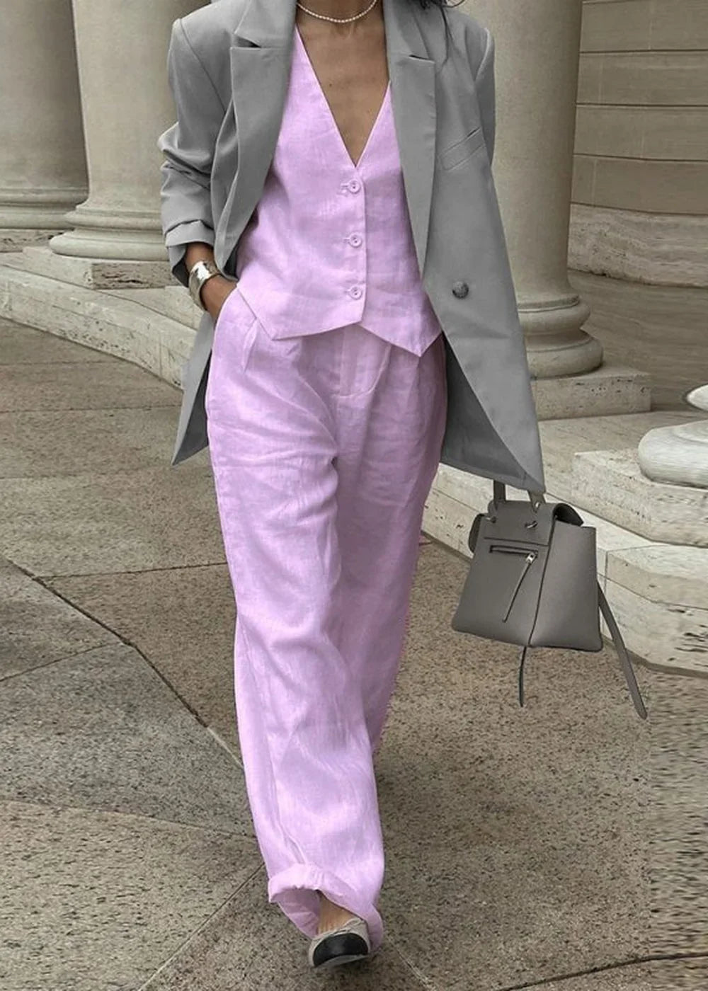 Lavender linen blend pant suit with a grey blazer, showing a relaxed fit and button details.