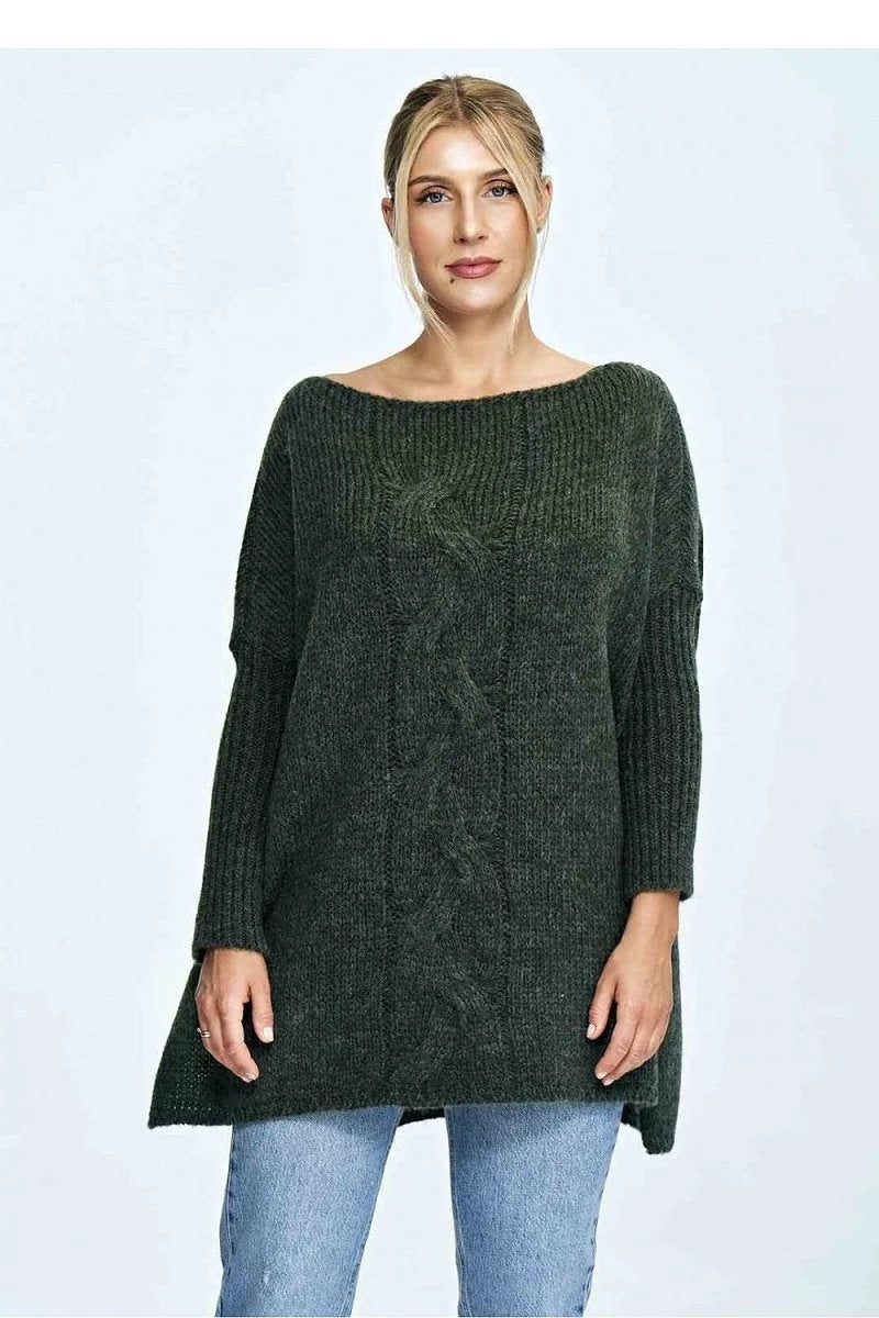 Loose-fit, dark green cable-knit sweater with a boat neckline on a woman wearing light wash jeans.