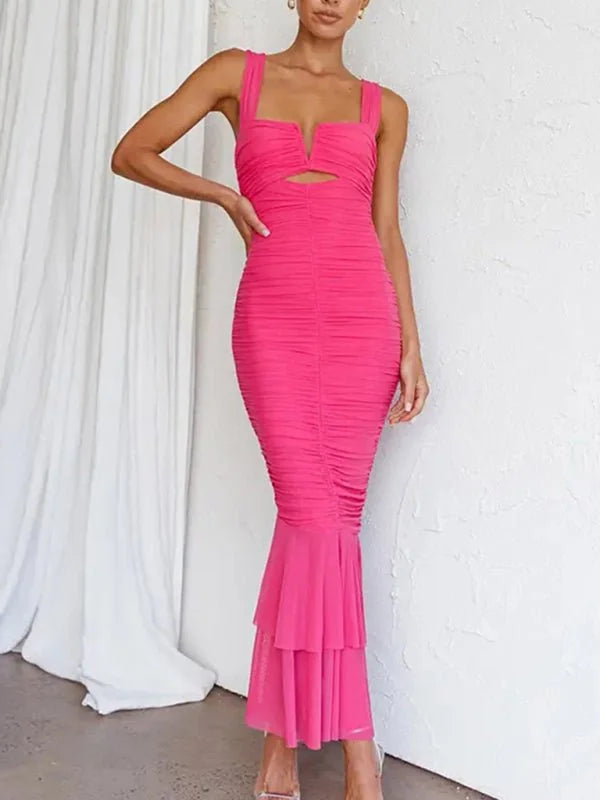 Hot pink ruched maxi dress with a cutout bust and tiered ruffle hem on model.
