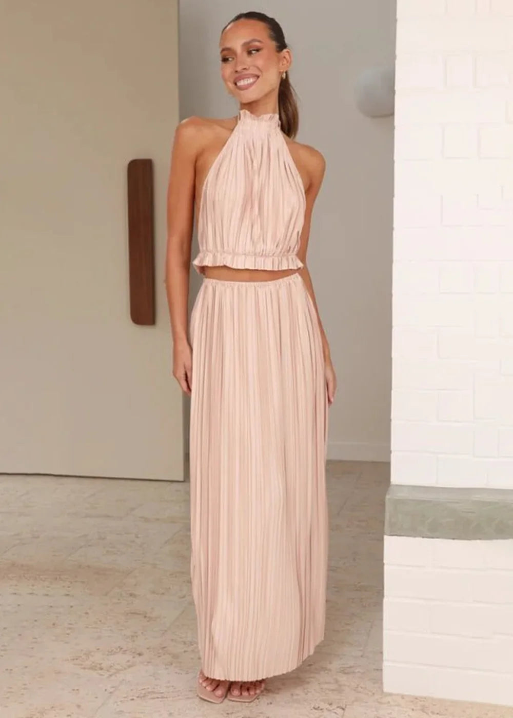 Women's pale green halter neck pleated skirt suit