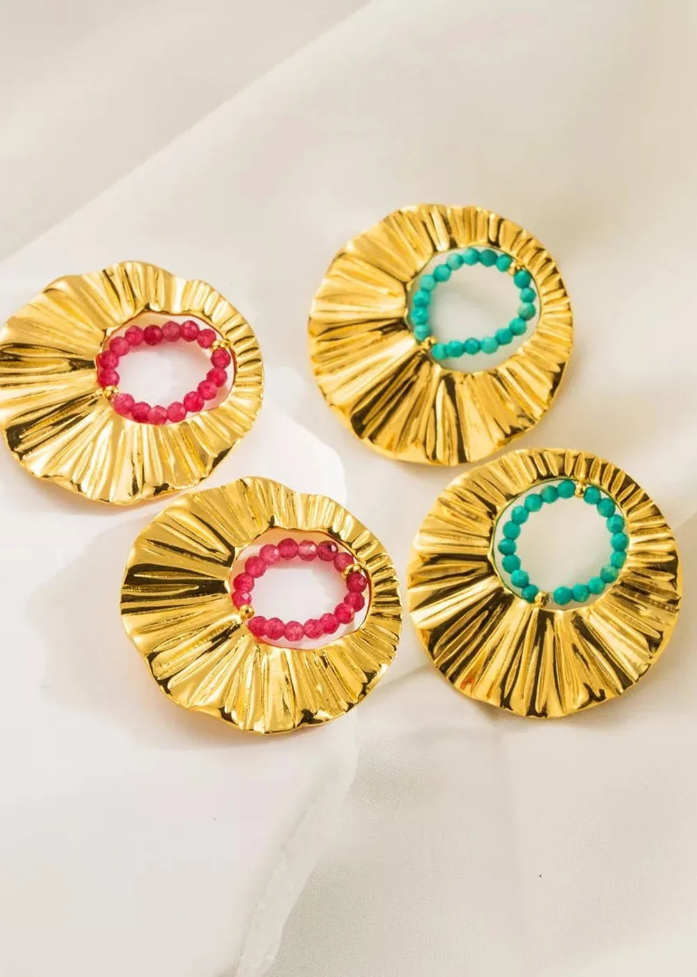 Gold-plated earrings with pink and turquoise bead accents, featuring a fluted design.